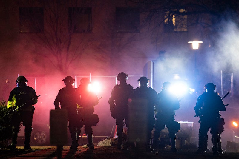 Law enforcement officers clear an area of demonstrators during a protest over the fatal shooting of Daunte Wright during a traffic stop, outside the Brooklyn Center Police Department in Brooklyn Center, Minn. AP