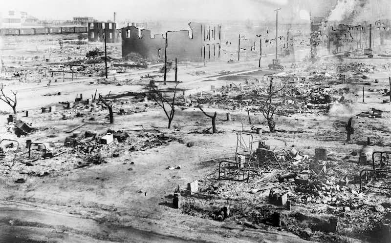 During the Tulsa race riots in 1921, Black businesses and homes in the Greenwood District in Tulsa, Oklahoma, were destroyed at the hands of white residents. Bettmann Archive/Getty Images