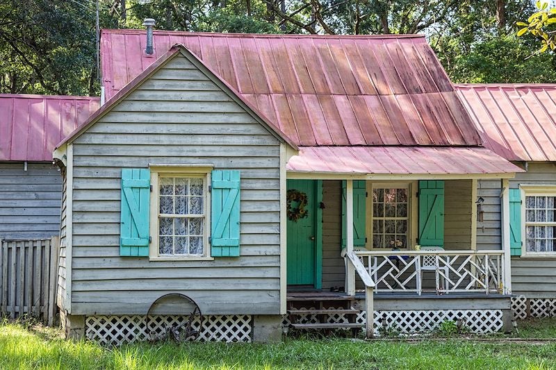 At this Gullah Geechee home on Daufuskie Island, South Carolina, painted doors and shutters keep out evil spirits called "haints." DAWNA MOORE / ALAMY