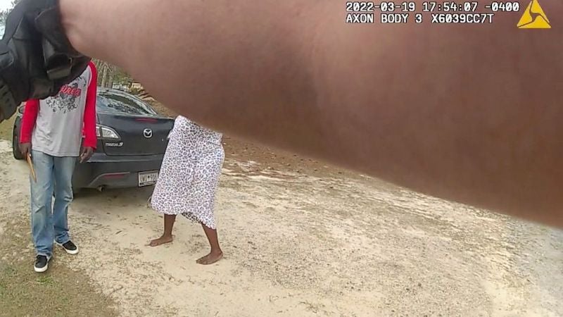In this image from the body camera video of Richland County Sherrif's Deputy John Anderson, Irvin D. Moorer Charley, 34, holds a piece of wood as he walks towards Anderson, who is backpedaling, in Columbia, S.C. Moorer Charley was shot and killed after deputies responded to a call about domestic violence. (Deputy John Anderson/Richland County Sheriff's Department via AP)