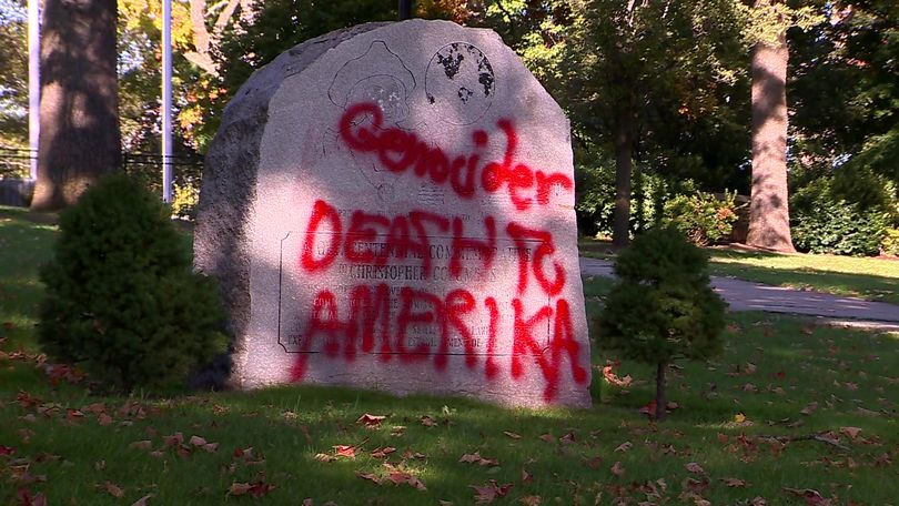 Words spray painted in red were scrawled across the front of the stone monument located on Waltham Common.