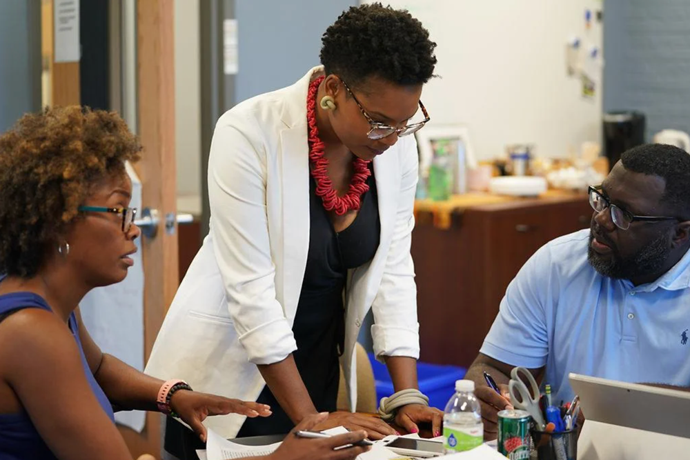 Ashley Woodson, center, at Douglass High School in 2018 by ABIGAIL YOUNG/MISSOURIAN