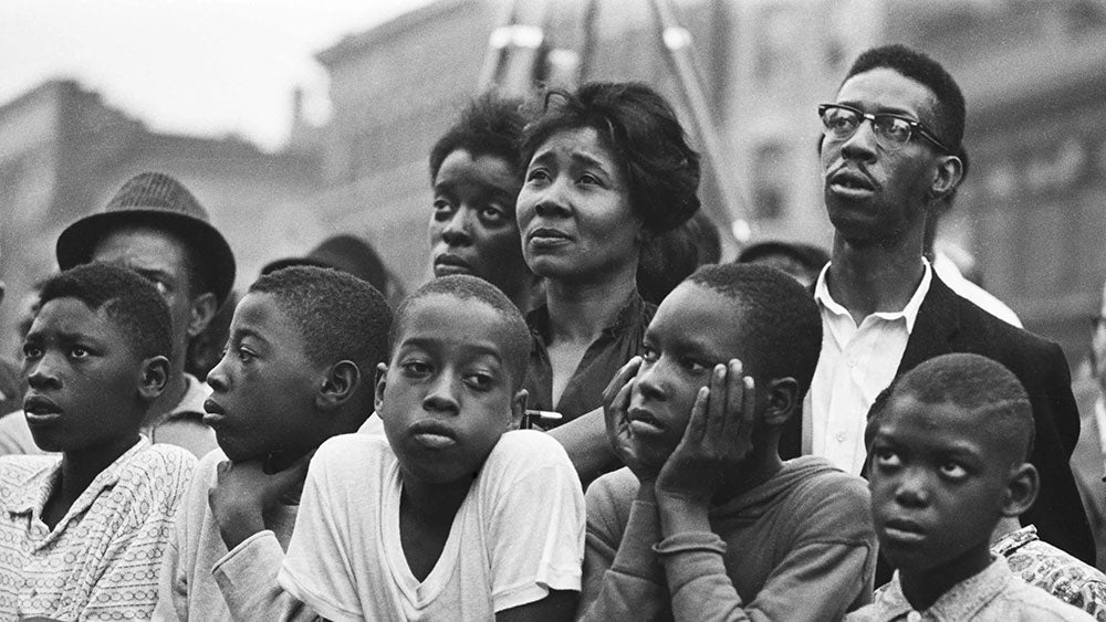 people in harlem listen to malcolm x in 1963