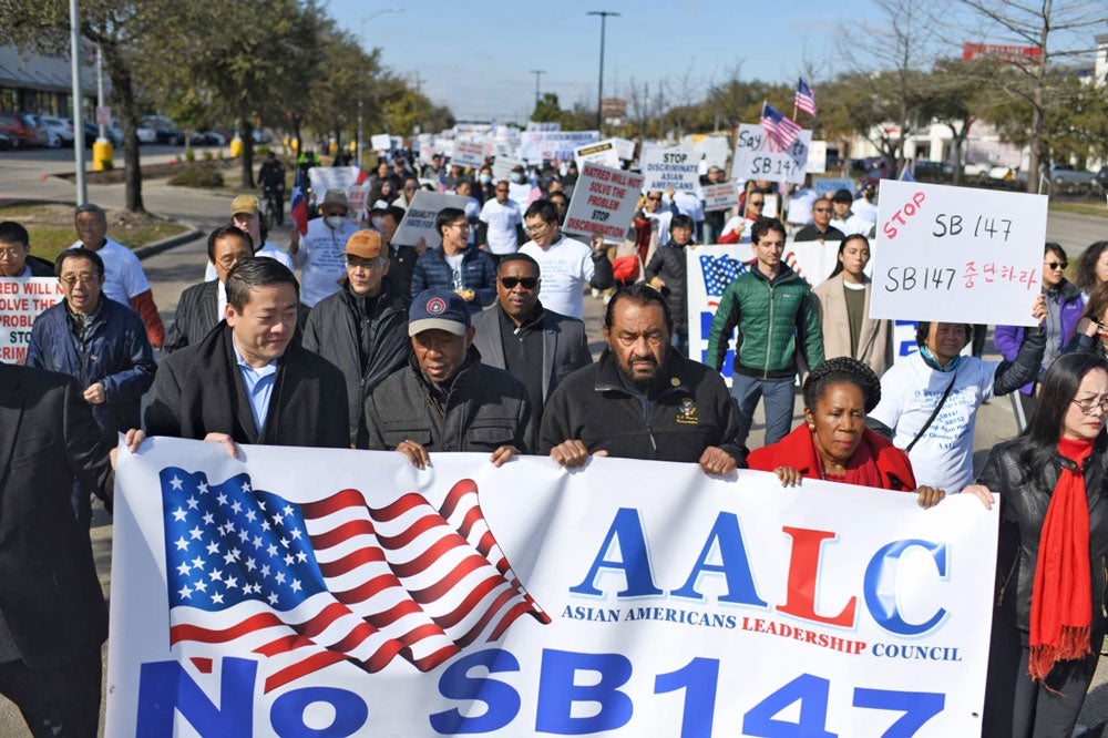 From left, Texas state Rep. Gene Wu, Houston Mayor Sylvester Turner, Democratic U.S. Reps. Al Green and Sheila Jackson Lee and Ling Luo, the founding chair of the Asian American Leadership Council, protest in Houston on Feb. 11