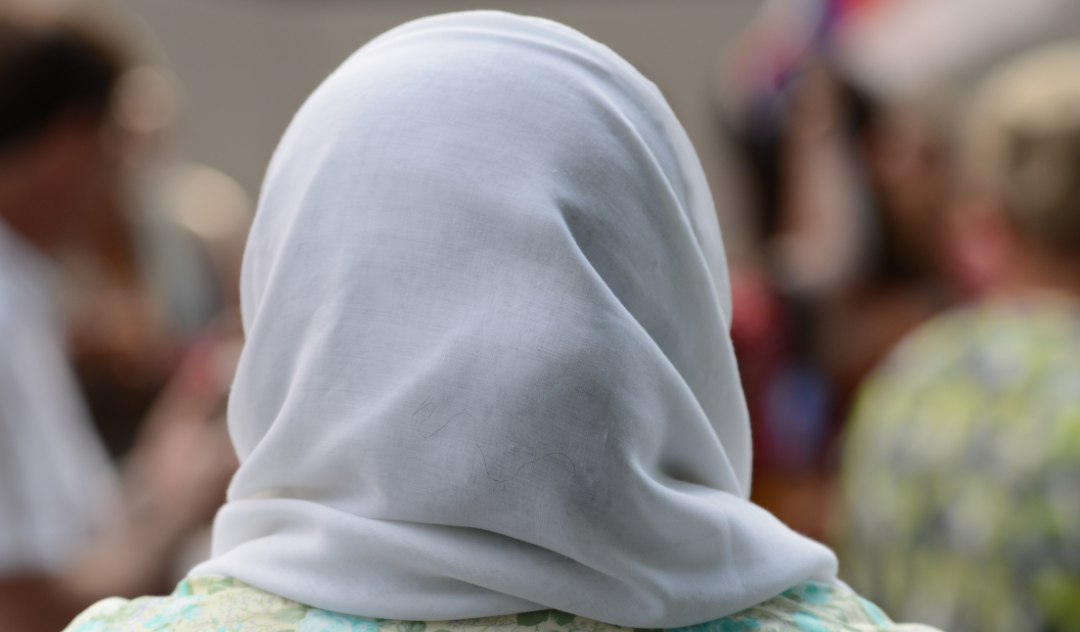 The back of a person wearing a hijab