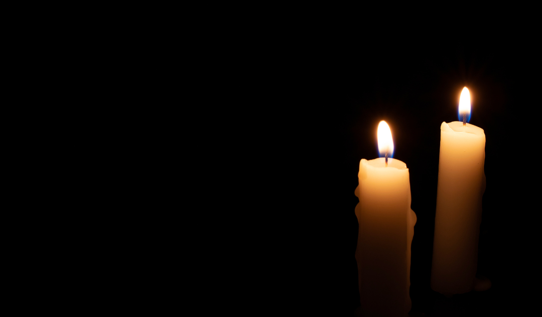 Two lit candles in the darkness, RARE Workgroup
