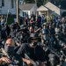 NFAC members kneel in the street during a September march in Louisville, Kentucky