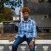 Rainier Harris, a senior at Regis High School, near his home in Queens.Credit...Hiroko Masuike/The New York Times