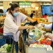 Getty/The Boston Globe/Stan Grossfeld Customers and cashiers wear face masks at a supermarket in Quincy, Massachusetts, on March 13, 2020.