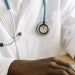 Close up on doctor coat and hands
