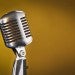 Microphone against a yellow shaded backdrop