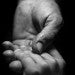 Adult hand holding a child's hand, RARE Workgroup