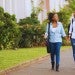 two students walking on a path