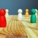 Multi-colored wooden figurines of people, Rice University Sociology RARE Workgroup